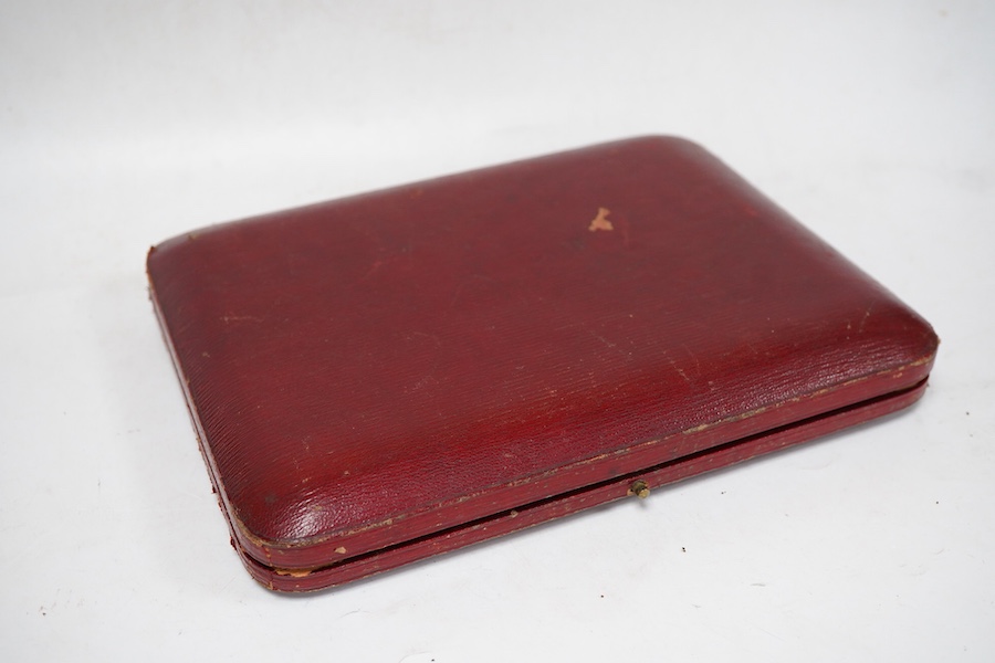 A cased pair of late Victorian silver spoons, the pierced terminals decorated with the busts of a lady and gentleman, James Dudley, London, 1898/1900, 19cm, 5.2oz.